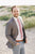 Dusty Rose Tie worn with a white shirt, gray suit jacket and blue pants.