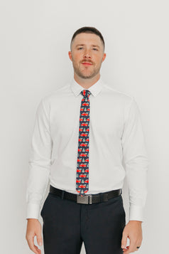 DAZI Forest Fleet Tie worn with a white shirt, black belt and black suit pants.