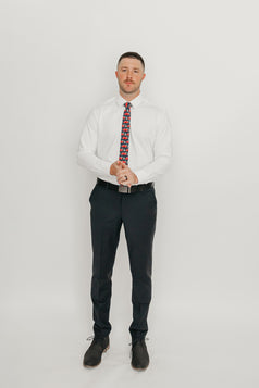 DAZI Forest Fleet Tie worn with a white shirt, black belt and black suit pants.