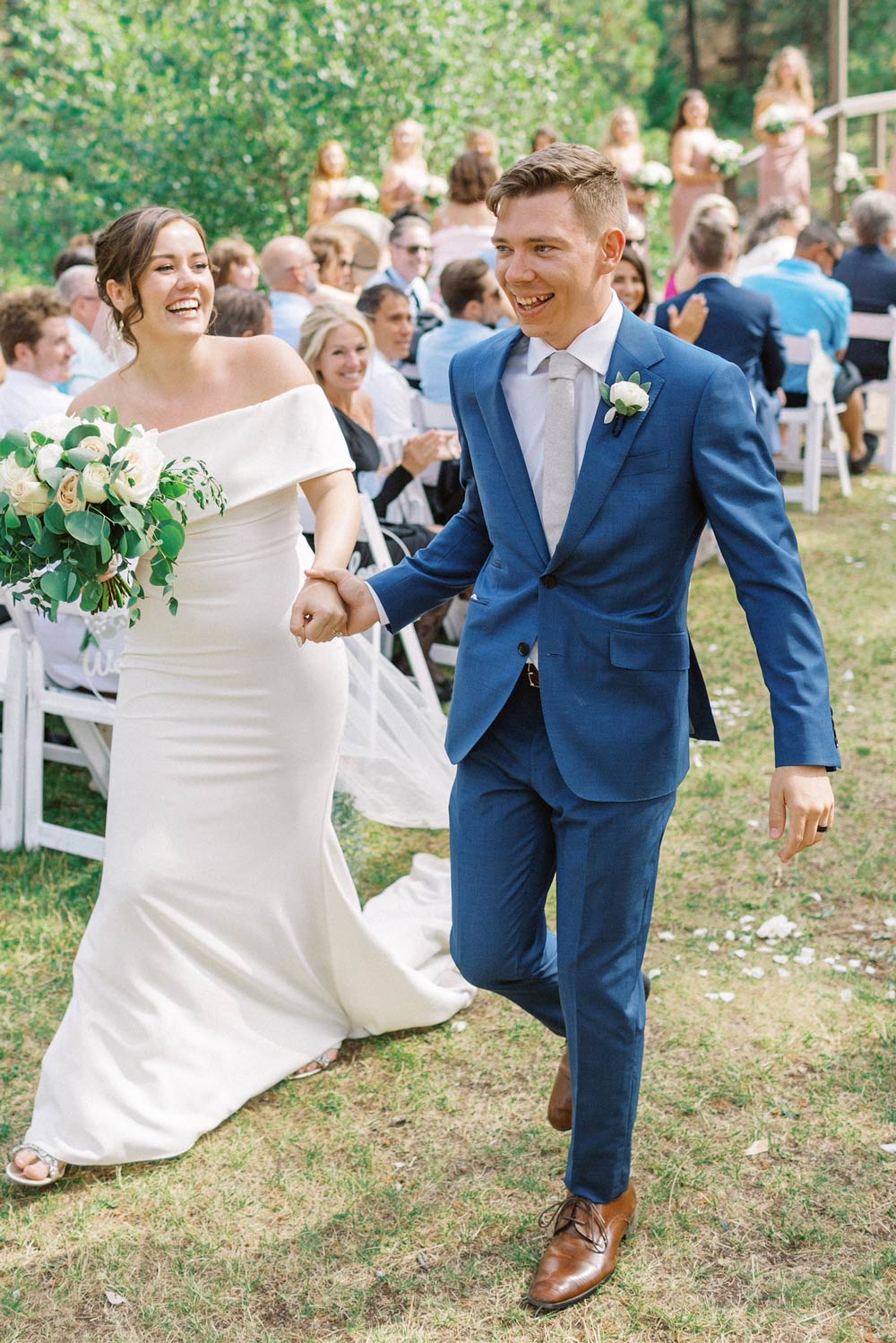 Onyx tie worn with a white shirt and blue suit.