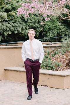 Pale Pink Tie worn with a white shirt and plum purple suit.