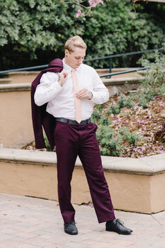 Pale Pink Tie worn with a white shirt and plum purple suit.