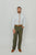 Quicksand Roses tie worn with a white shirt, brown belt and olive green pants.