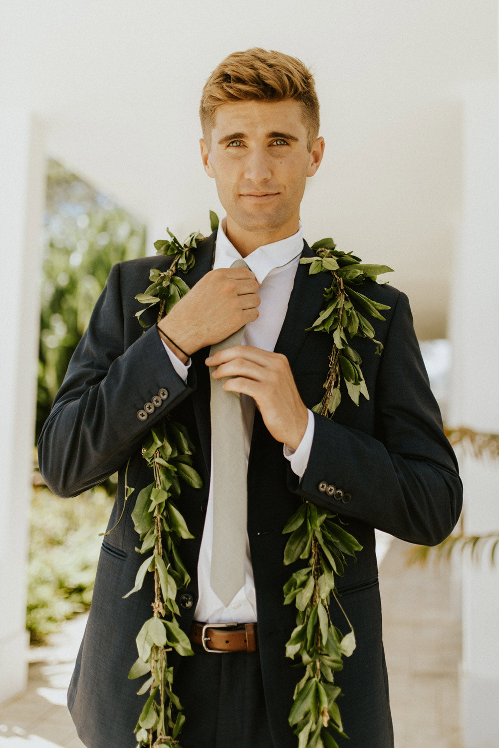 Sage Tie worn with a white shirt and gray suit. 