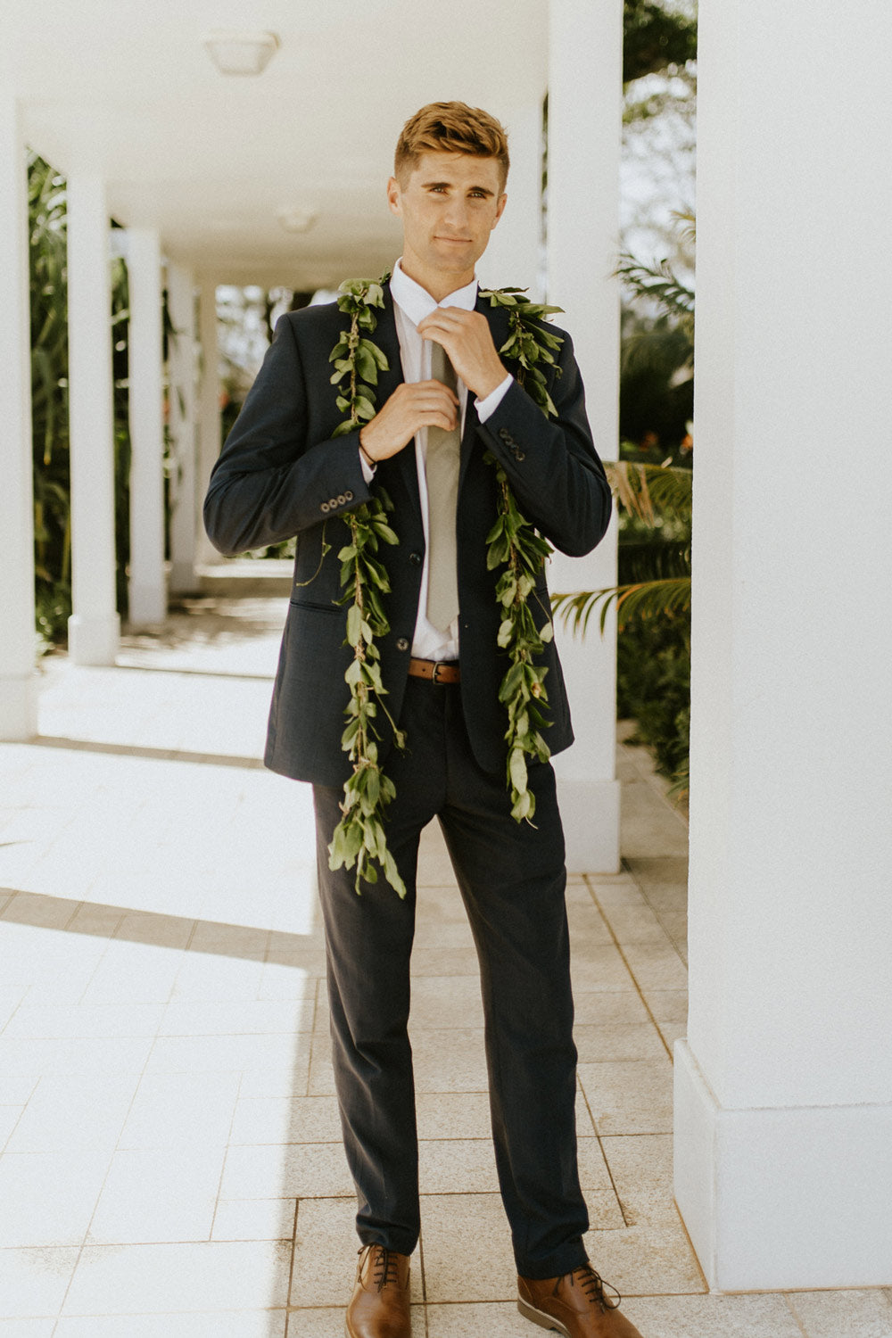 Sage Tie worn with a white shirt and gray suit. 