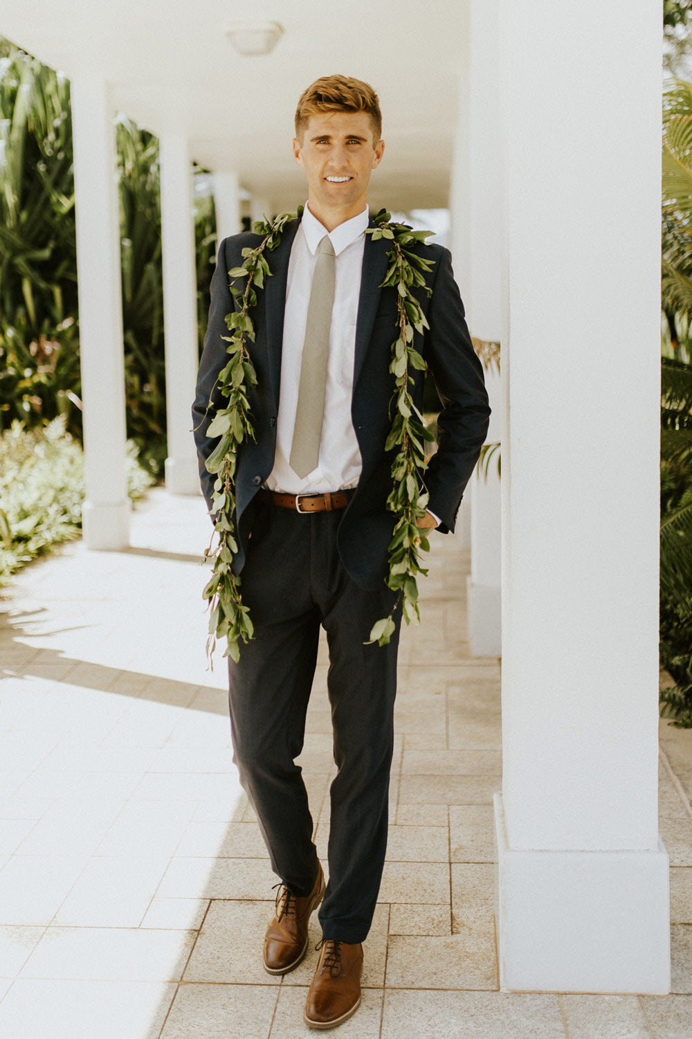 Sage Tie worn with a white shirt and gray suit. 