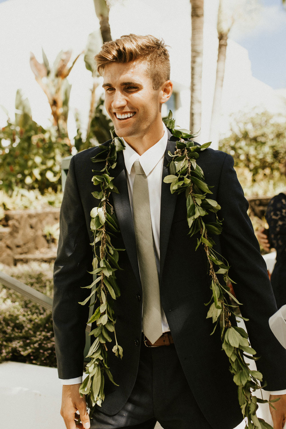 Sage Tie worn with a white shirt and gray suit. 