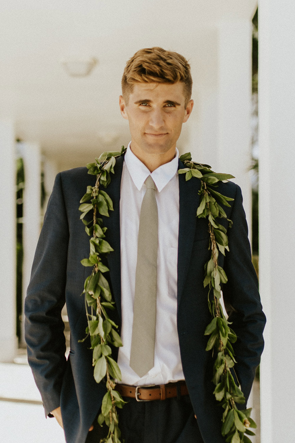 Sage Tie worn with a white shirt and gray suit. 