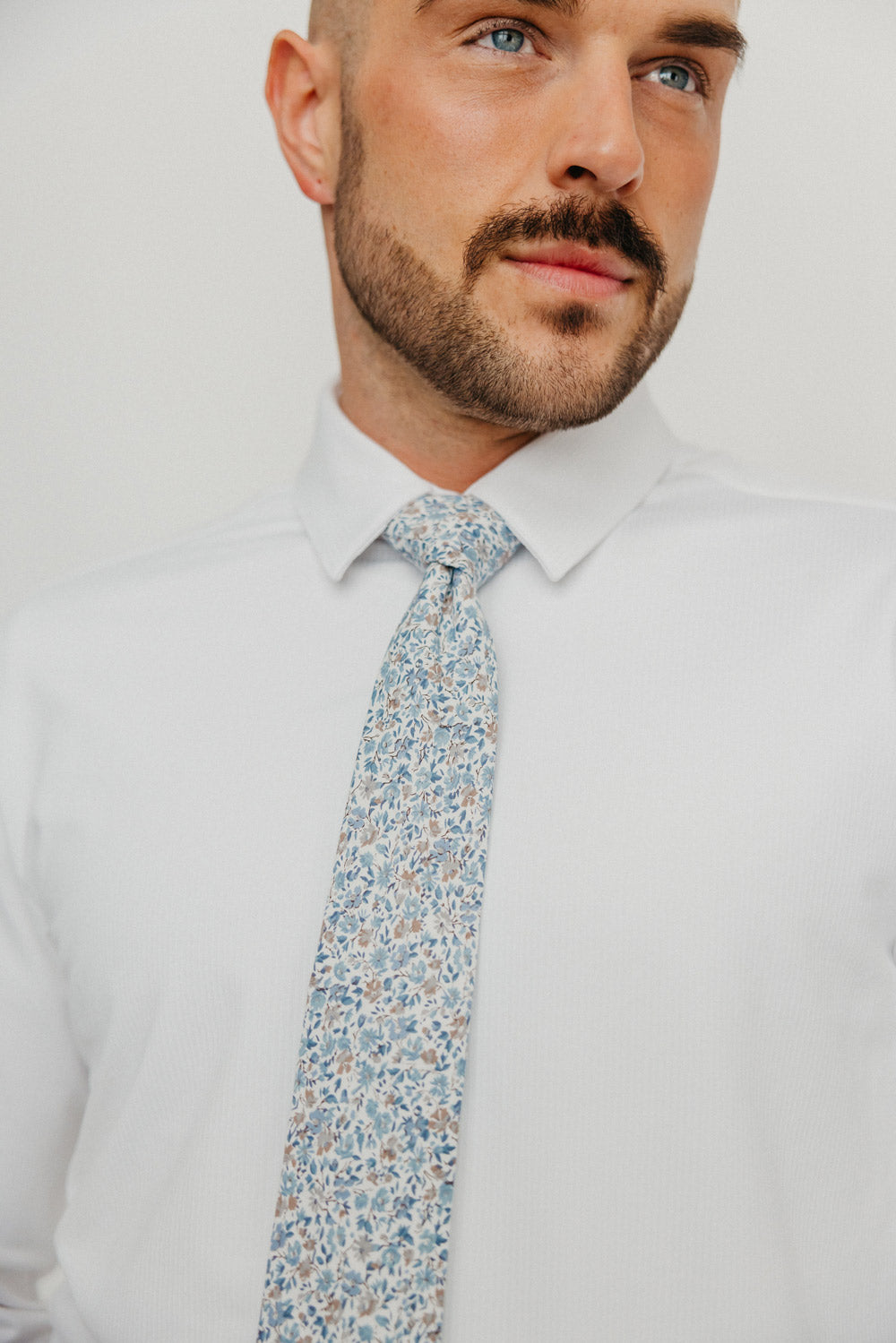 Scorpion Grass tie worn with a white shirt.