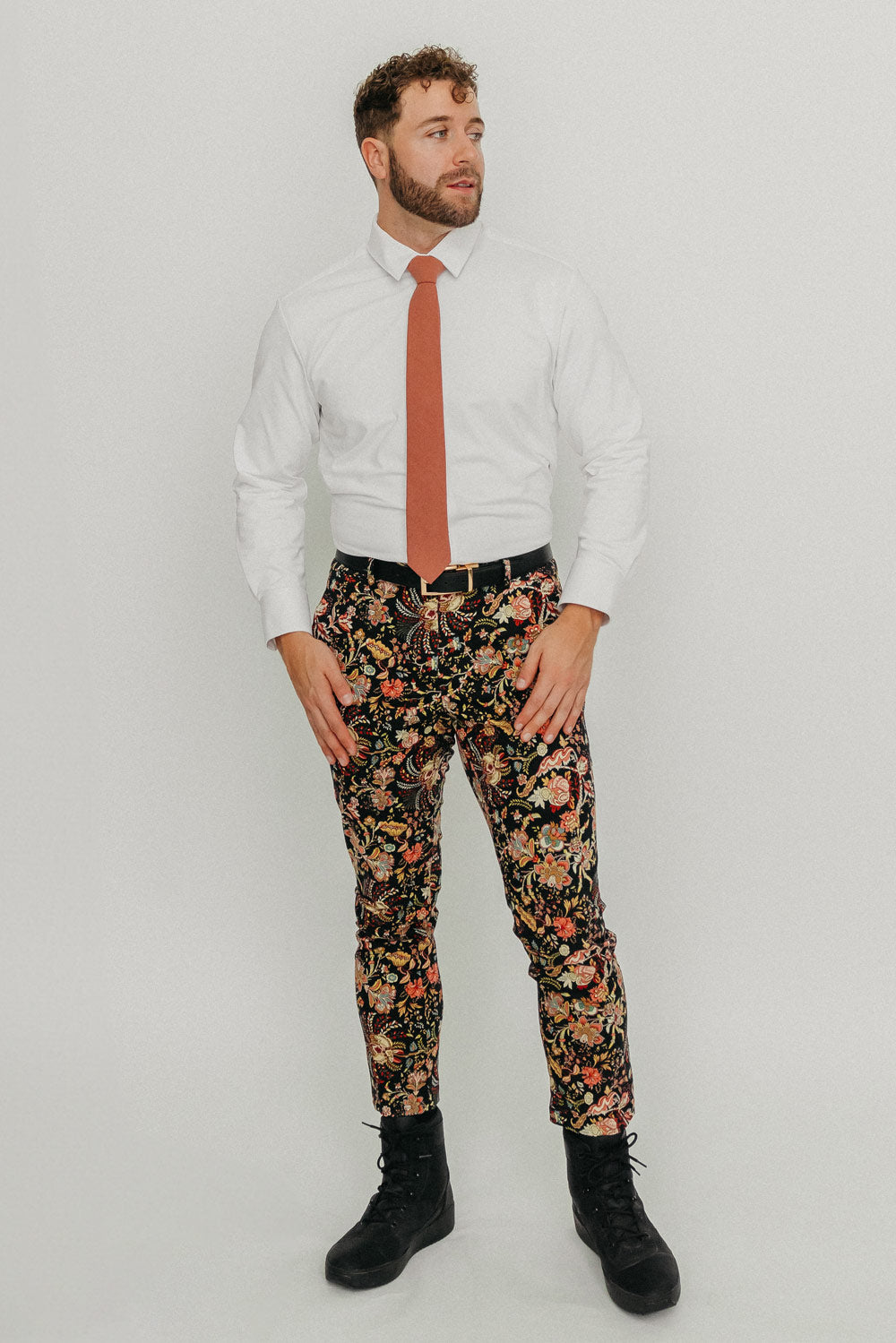 Sedona tie worn with a white shirt, black belt and floral pants.