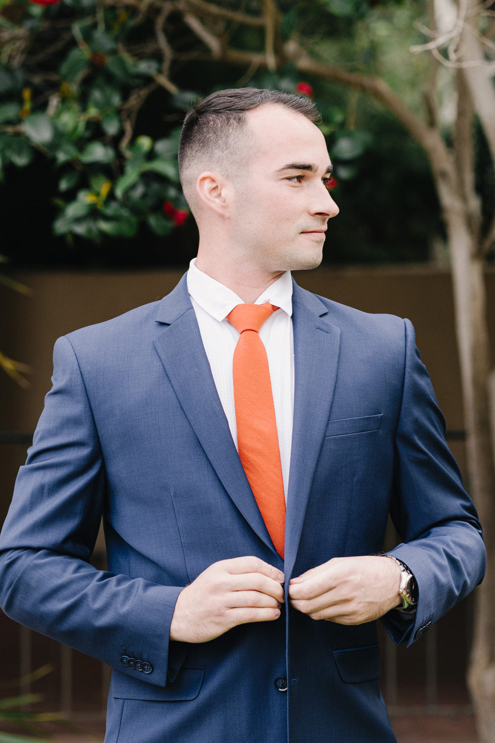 blue suit orange tie