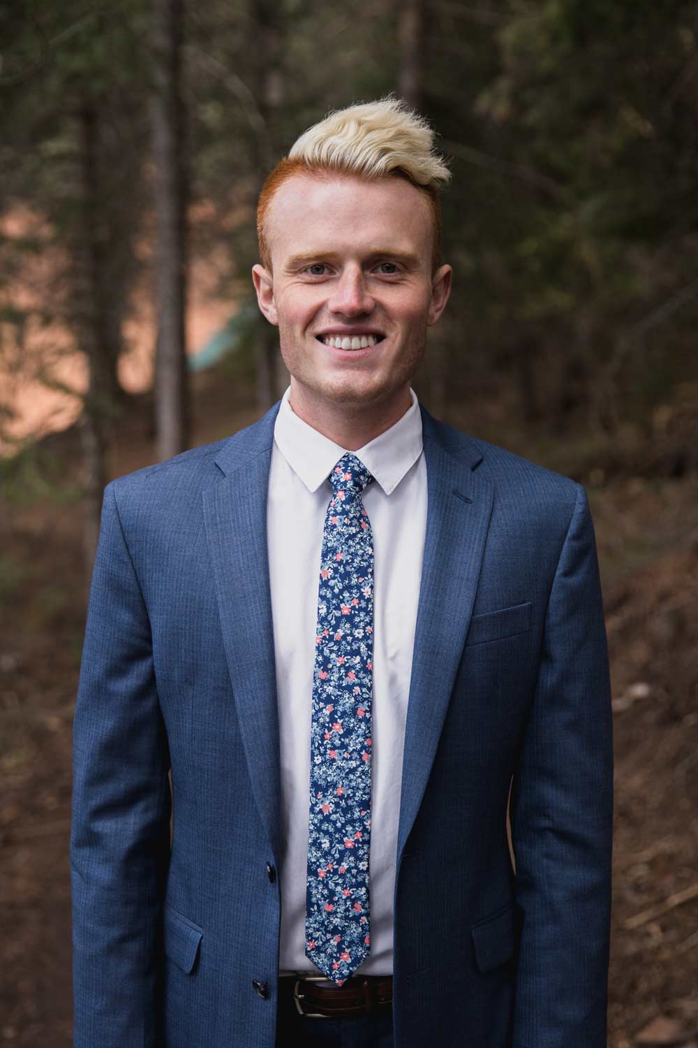 Atlanta tie worn with a white shirt and blue suit jacket. 