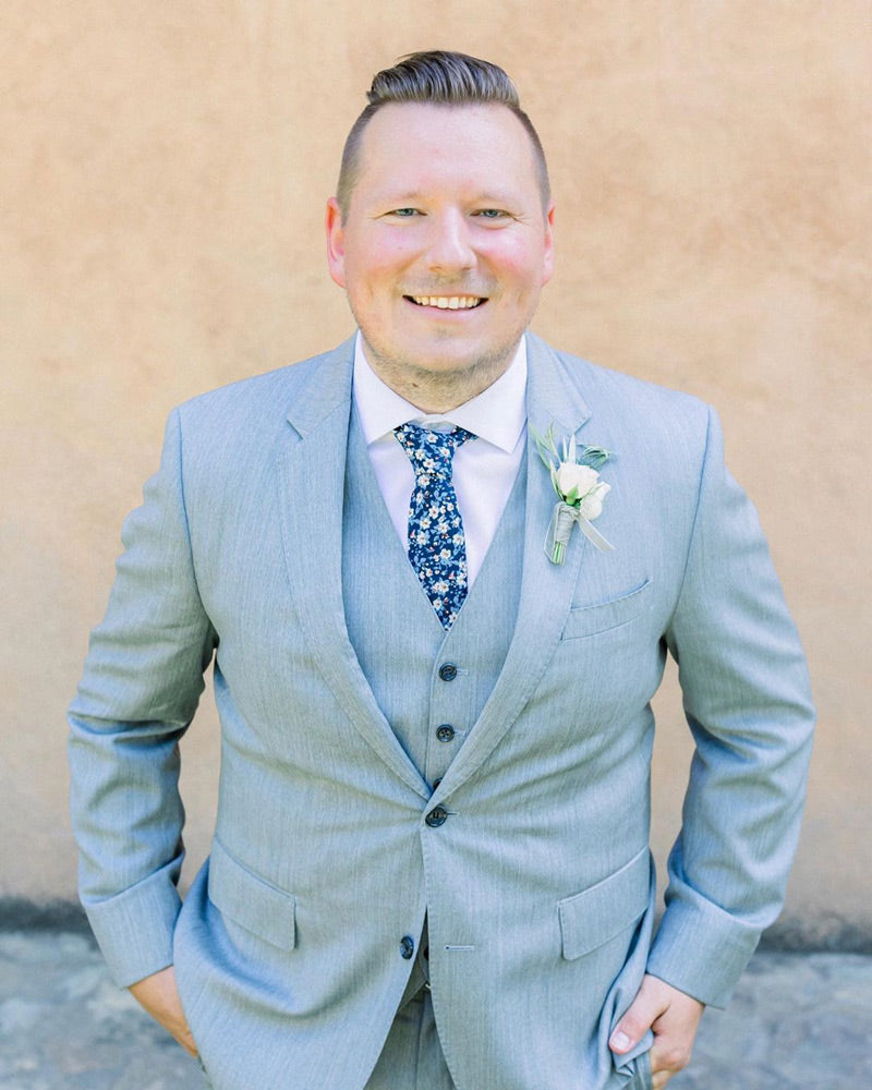 Blueberry Bliss tie worn with white shirt and light gray three-piece suit.