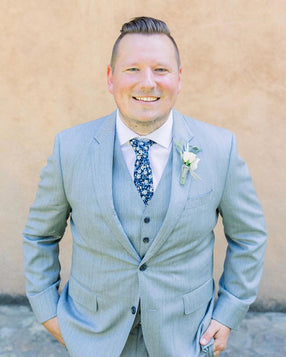 Blueberry Bliss tie worn with white shirt and light gray three-piece suit.