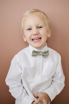 Calla Lily pre-tied bow tie worn with a white shirt.