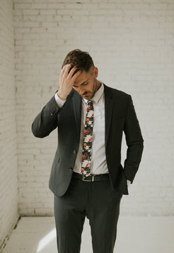 Crimson Rose tie worn with a white shirt, black suit jacket, black belt and black pants.