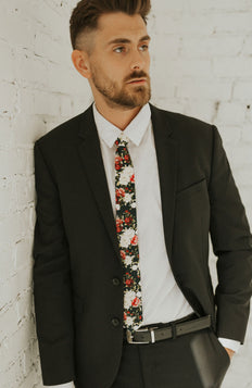 Crimson Rose tie worn with a white shirt, black suit jacket, black belt and black pants.