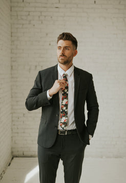 Crimson Rose tie worn with a white shirt, black suit jacket, black belt and black pants.