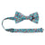 Dahlia Pre-Tied Bow Tie with adjustable neck strap. Light blue background with a variety of small pink, red, salmon and white flowers and green leaves. 