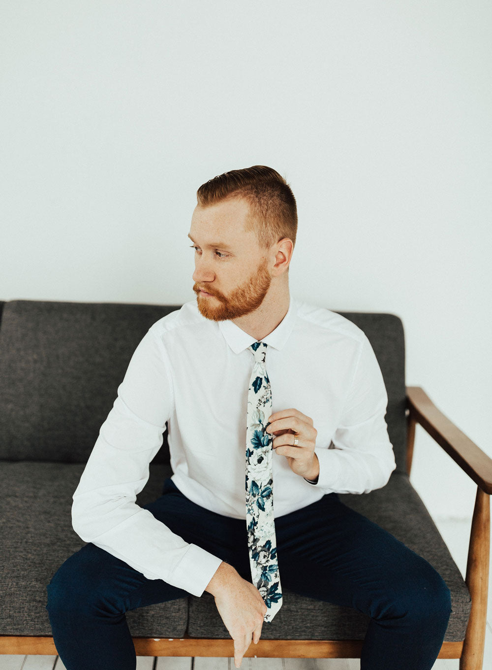 Dreamy Fields tie worn with a white shirt and black pants. 