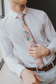 Dusty Lily tie worn with a white shirt, brown belt and gray pants.