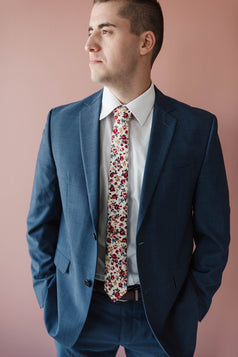 Fiore tie worn with a white shirt and blue suit. 