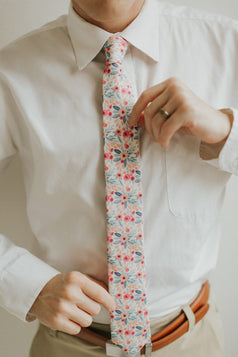 Hermosa tie worn with a white shirt, brown belt and khaki pants.