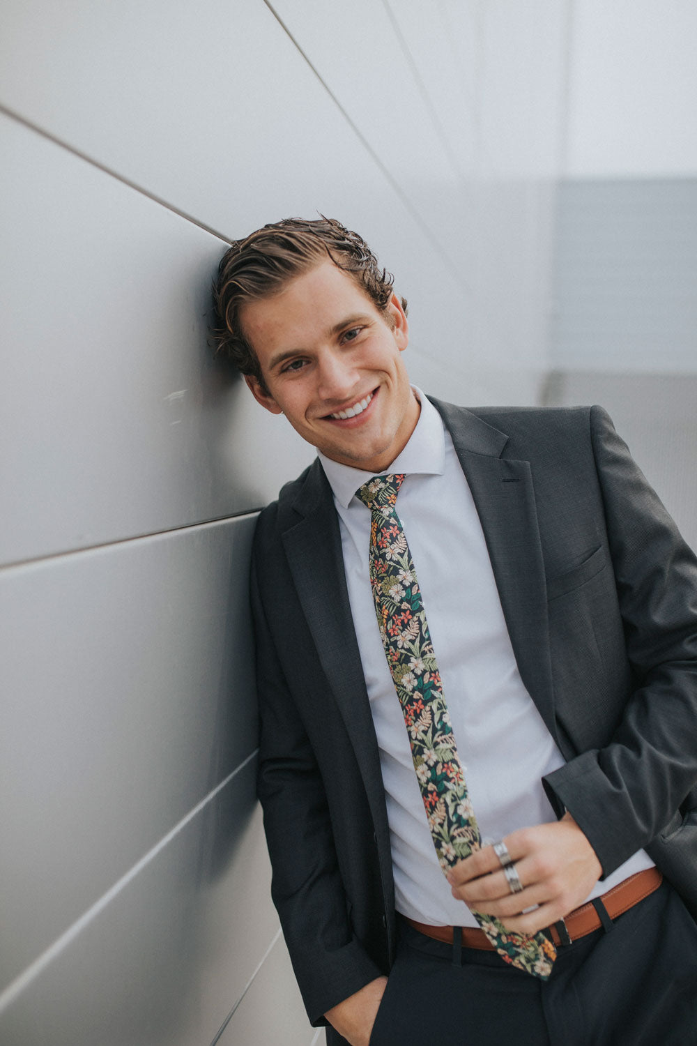 Jumanji tie worn with a white shirt and dark gray suit.