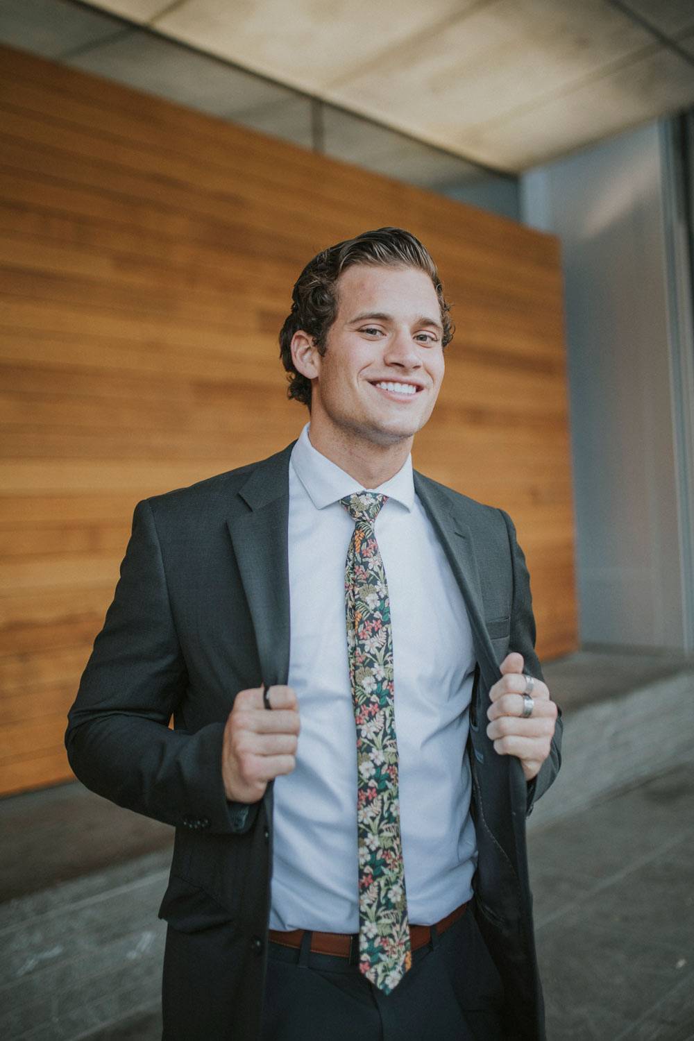 Jumanji tie worn with a white shirt and dark gray suit.