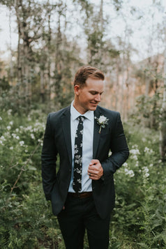 Nightfall tie worn with a white shirt and black suit.