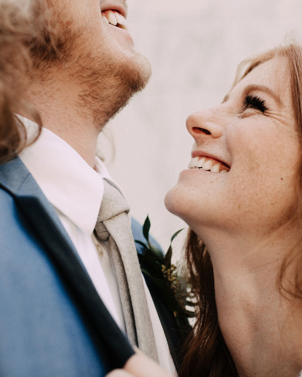 Onyx tie worn by a groom wearing a white shirt and blue suit jacket.