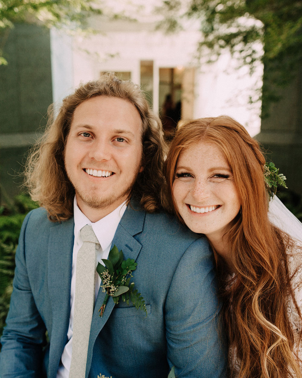 Onyx tie worn by a groom wearing a white shirt and blue suit jacket.