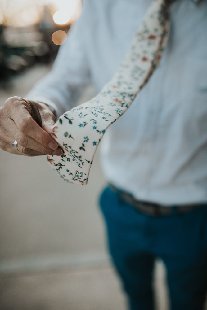 Sugar Blossom tie worn with a white shirt and navy pants.