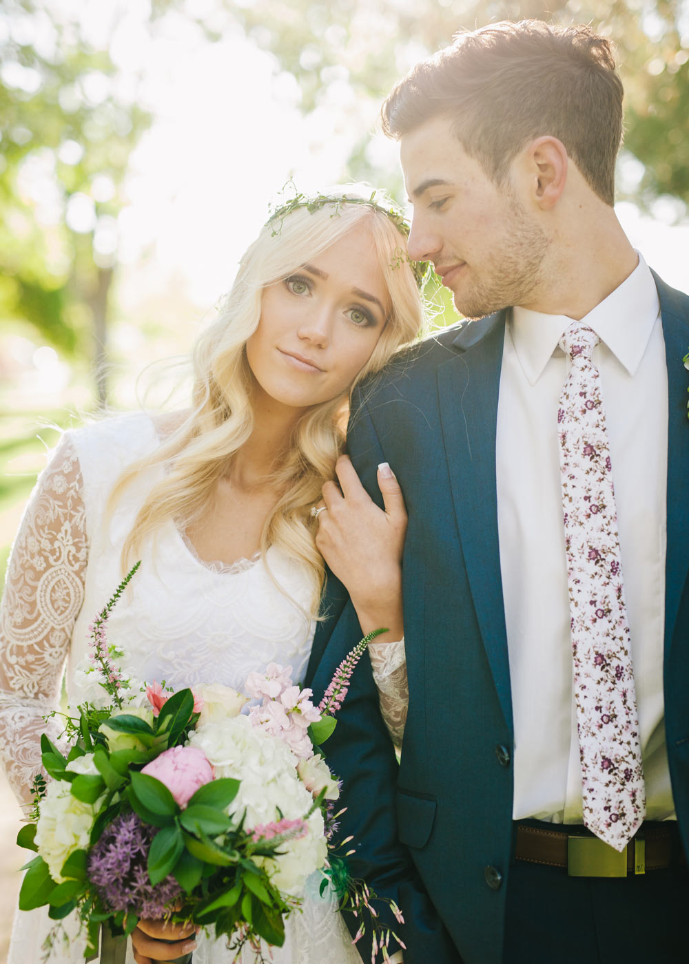 Sweetly Picked tie worn by a groom at his wedding with a white shirt and royal blue suit.