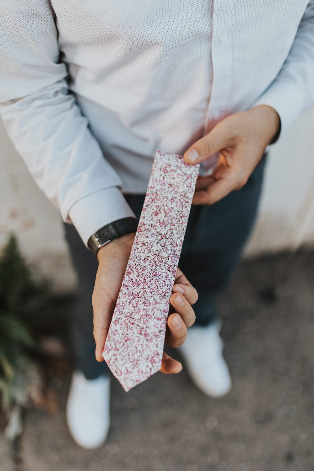 Close up shot of the Ventura tie being held in someone's hands. 