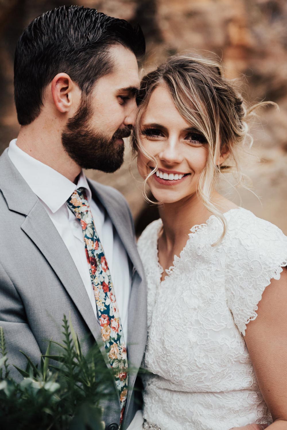 Mardi tie worn with a white shirt and gray suit jacket.